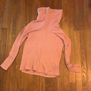 Pink turtleneck with slits in the bicep area